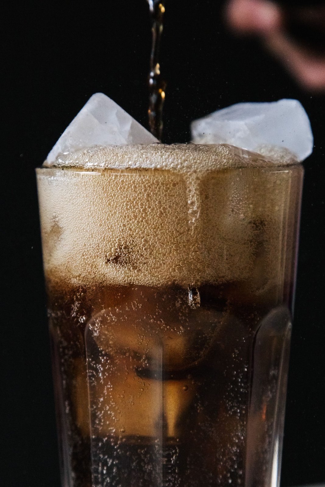 A glass of cola, the one carbonated drink repeatedly linked to lower hip bone density in US research