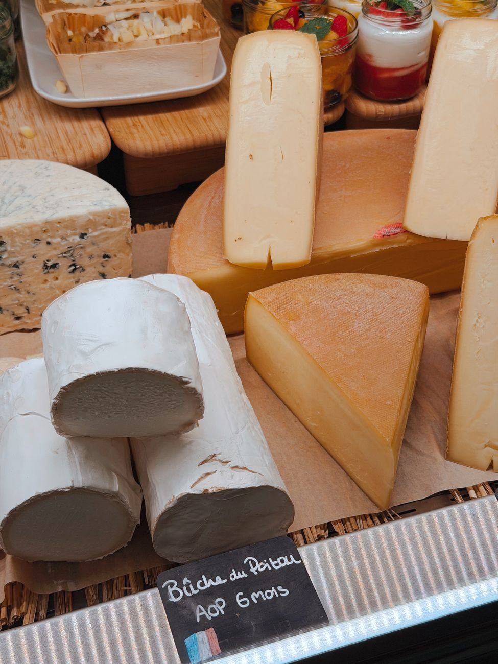 Wedges of aged cheese on a board, the ripened style highest in tyramine